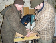 Loughie helps Stephen with the hollowing of the hull. Photo: MG